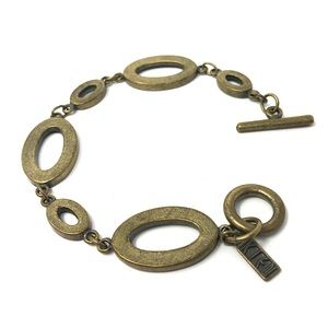 KIEN 1980s modernist bracelet in aged brass tone metal